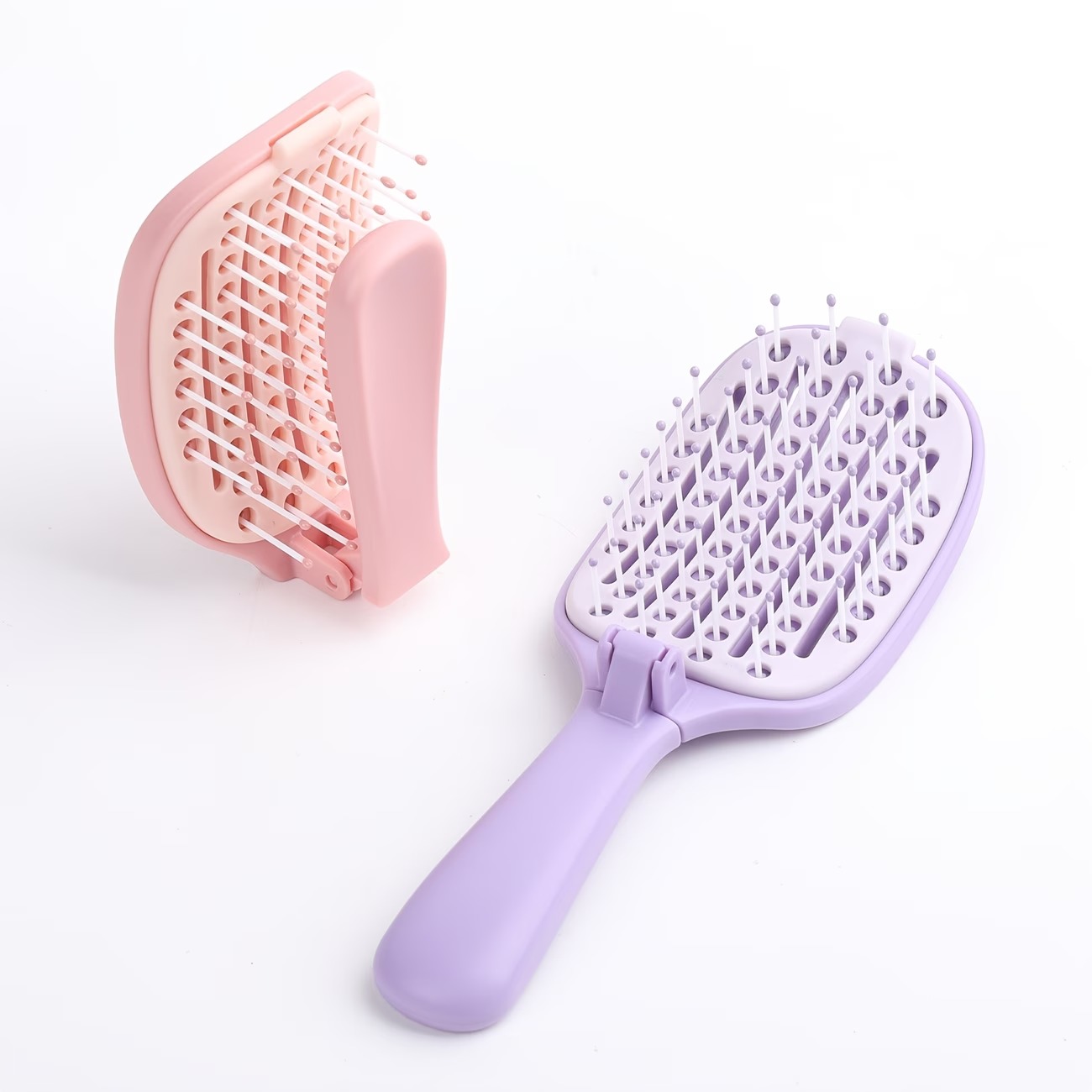 imgi_103_6a493c3f-7c6e-4d4c-947e-ca5043c699ce Foldable Self-Cleaning Detangling Hair Brush - Image 1