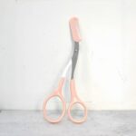 Precision Eyebrow Comb with Built-In Scissors – Stainless Steel Brow Trimming Tool with Random Postcard
