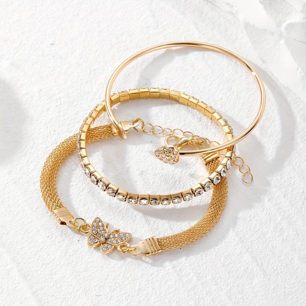 A delicate and versatile bracelet set combining sparkling rhinestones with elegant butterfly details for an effortlessly stylish layered look.